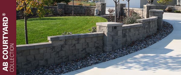 The AB Courtyard Collection® by Allan Block is a versatile, stackable wall system designed for building stylish outdoor features like garden walls, fire pits, and seating areas. Using interlocking blocks with a two-sided finish, it’s easy to install and great for creating custom patios and landscapes.