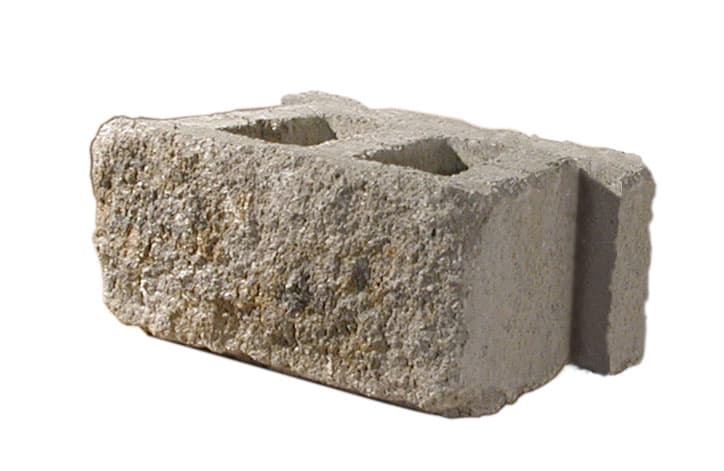 AB Dover retaining wall block — Full size retaining wall block with tumbled stone texture for a natural appearance. Integrated lip and notch design for built in setback. A hollow core design allows for drainage and easier handling.